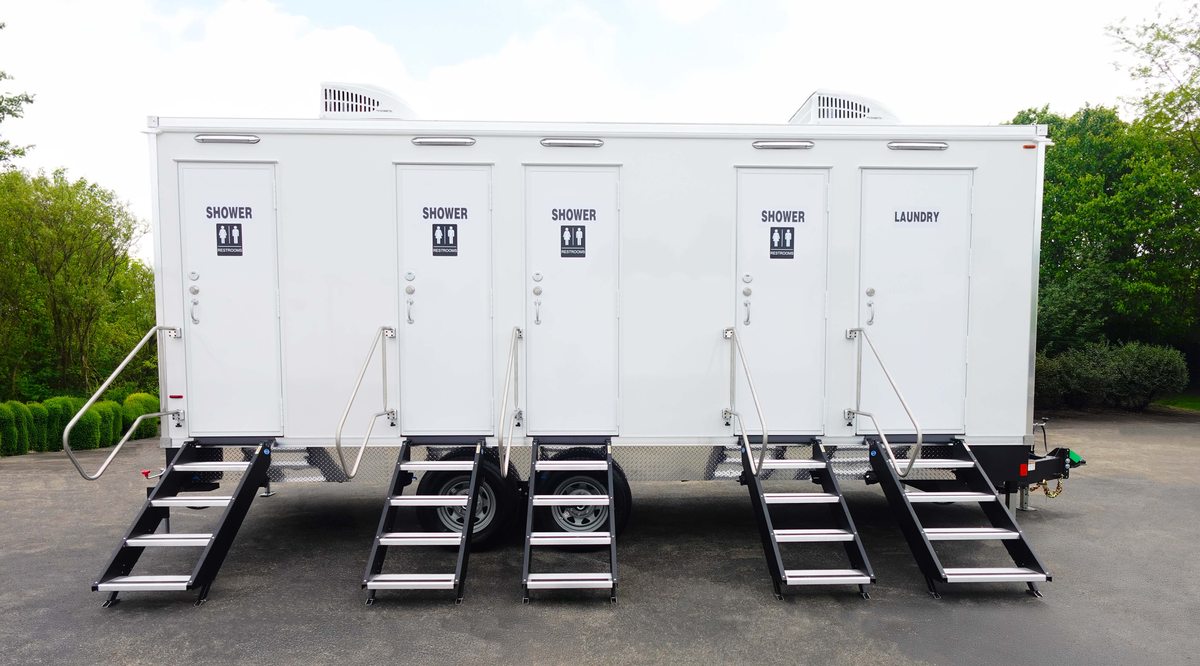 Full length combo trailer carrying showers, restrooms and a laundry bay in one chassis