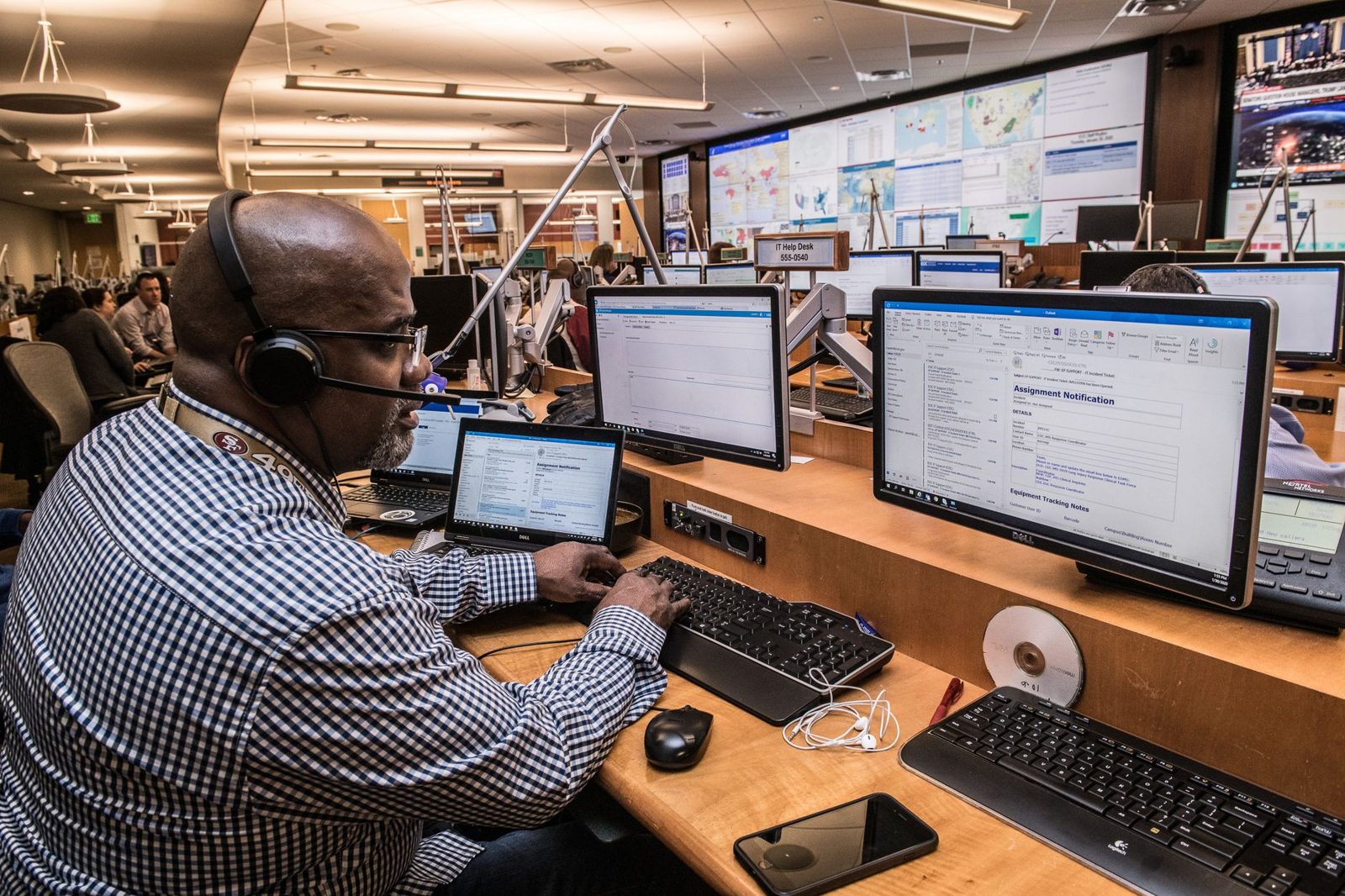 Staff working at screens in an emergency operations center