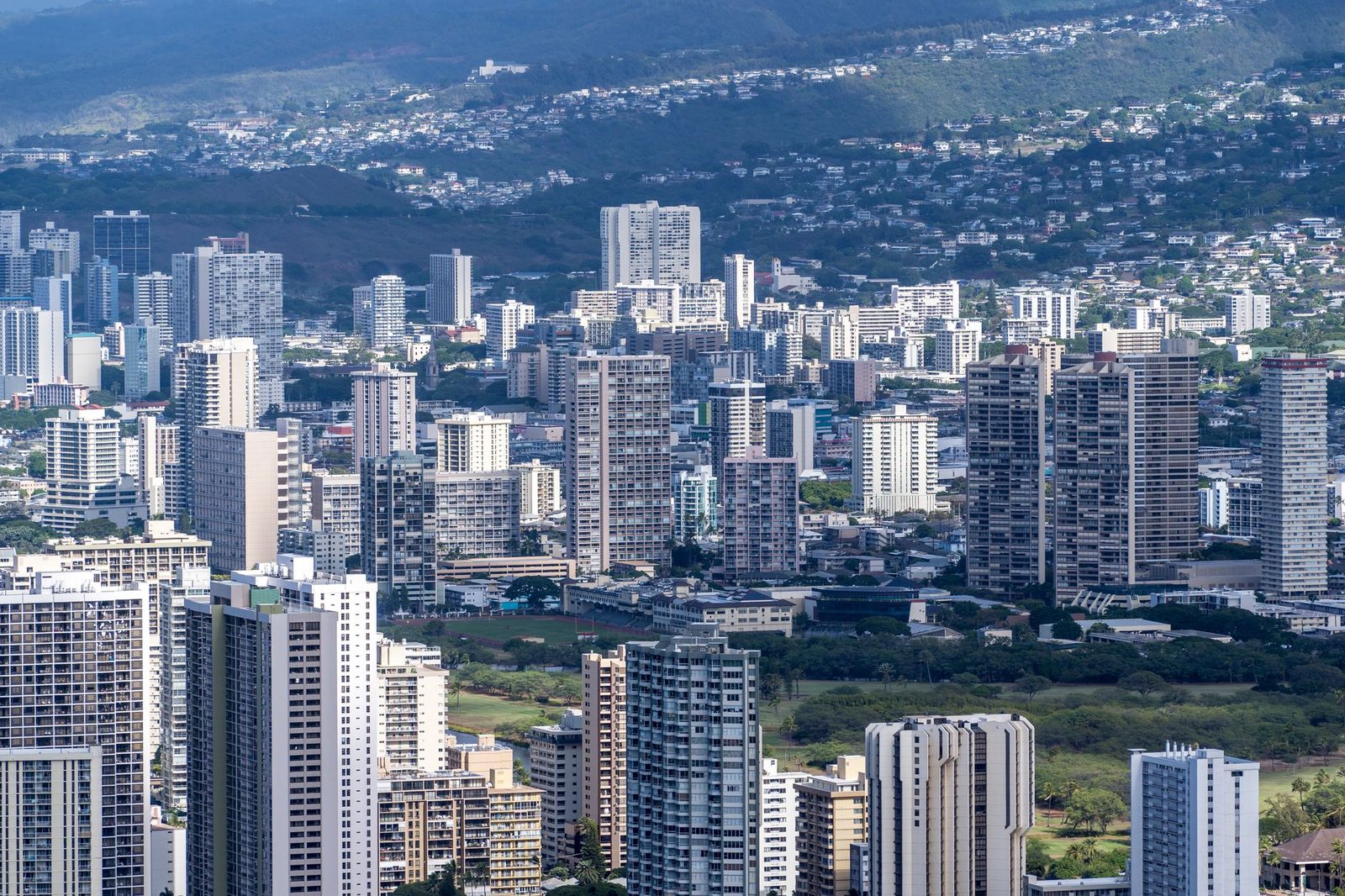 High-rise towers of Honolulu with the Koolau ridges behind