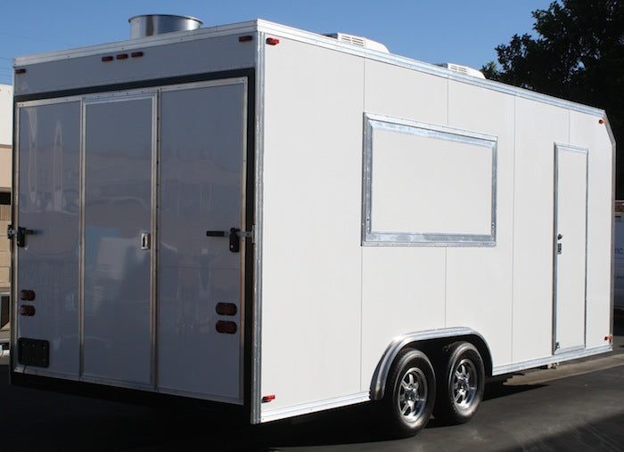 White mobile kitchen trailer with service windows open