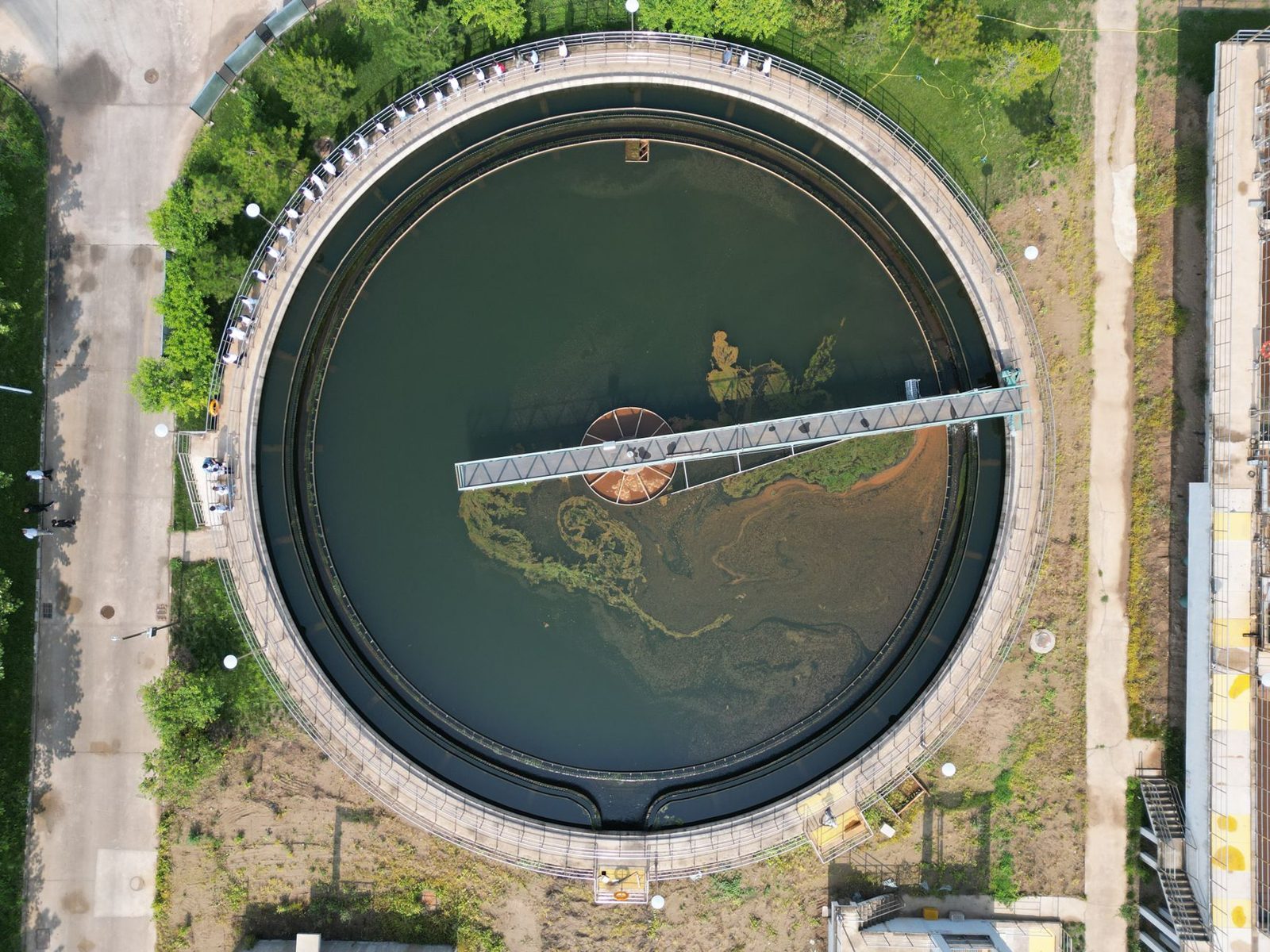An aerial view of a round clarifier at a treatment plant