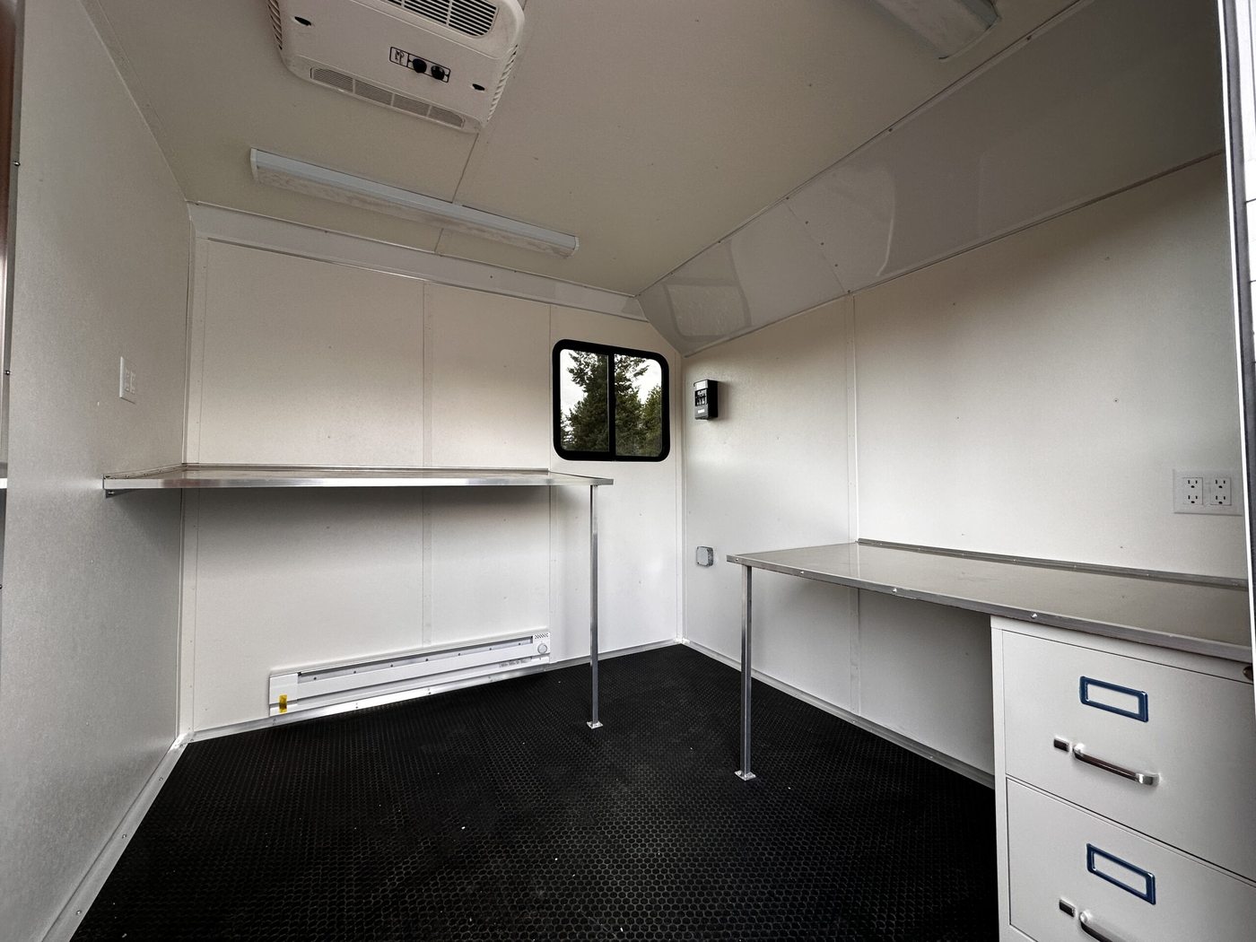 Office trailer interior with workstations set up and ready for the project team