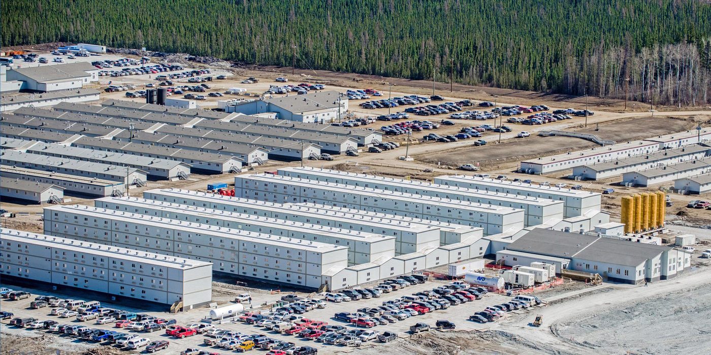 Aerial rows of a large workforce camp where on site laundry keeps crews out of town